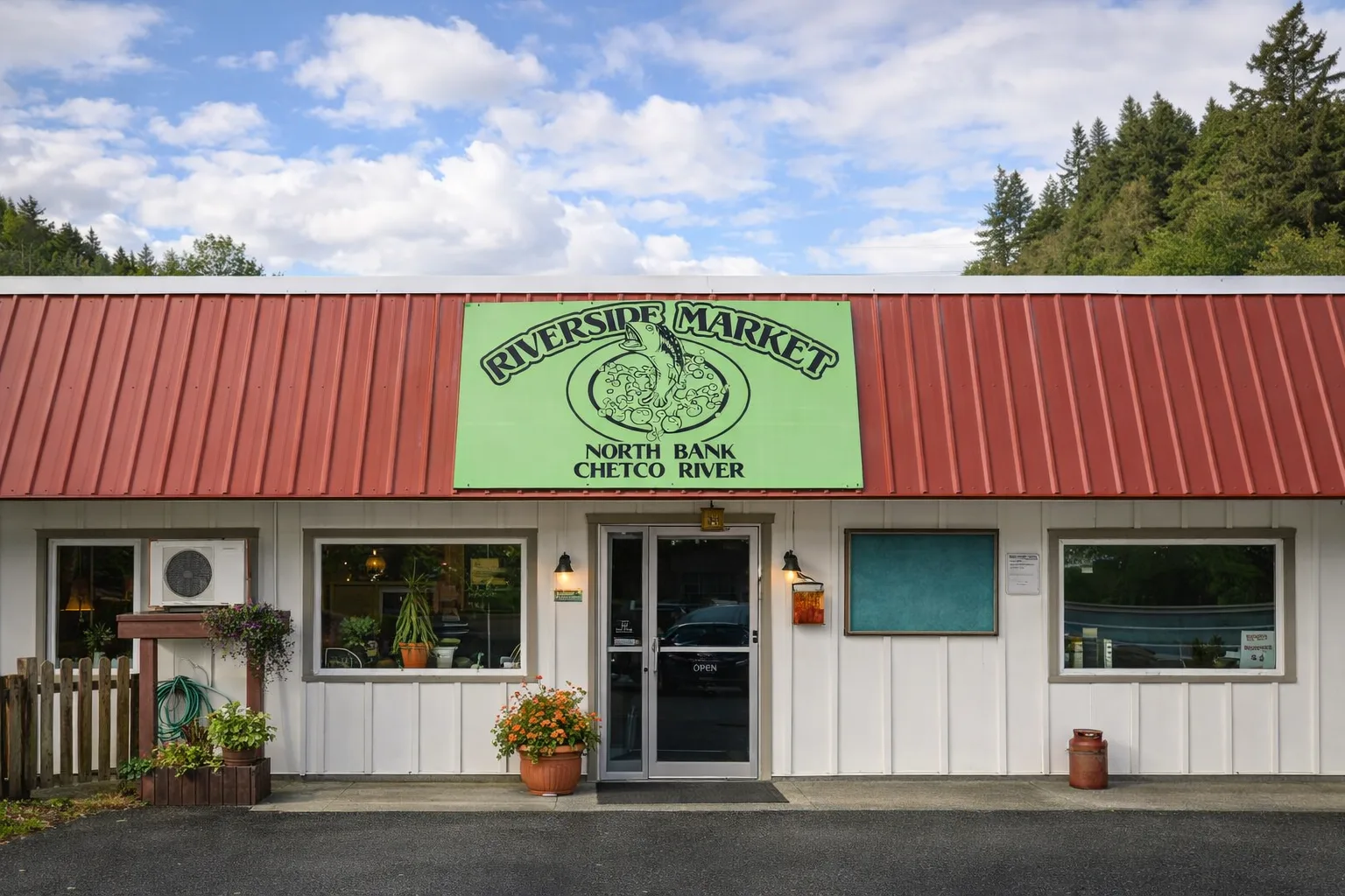 Riverside Market storefront with green sign and red roof on North Bank Chetco River Road